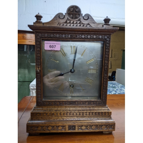 607 - A Winterhalder and Hofmeier oak cased mantel clock, silvered face with gilded Roman numerals (with p... 