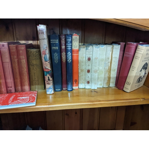 612 - A mixed lot to include a group of children's books, along with Charles Dickens books, travel books, ... 