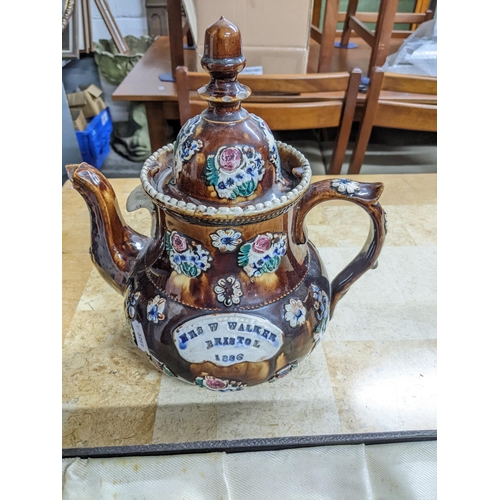 616 - A mixed lot to include a Victorian pottery barge ware teapot, named Mrs W Walker 1886 A/F, a silver ... 