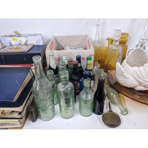 618 - A mixed lot to include various postcards and magazines, vintage glass bottles two Anglepoise lamps, ... 