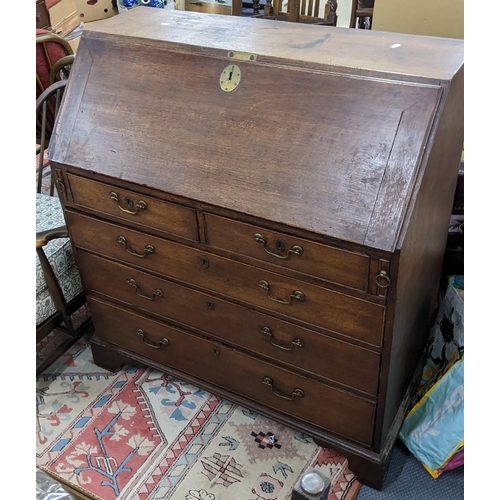 619 - A George III oak bureau with two short and three long drawers on bracket feet, 107.5high x 100.5cm w... 