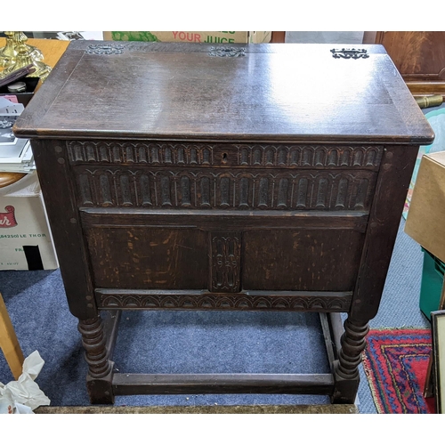 622 - A dark oak cabinet having a hinged top and bobbin turned legs 83.5cm high x 76cm wide
Location:RAB