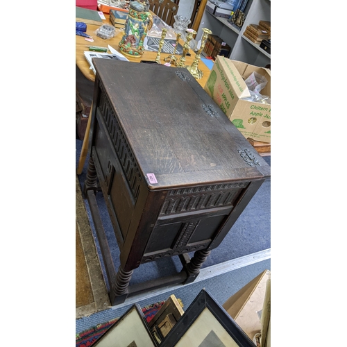 622 - A dark oak cabinet having a hinged top and bobbin turned legs 83.5cm high x 76cm wide
Location:RAB