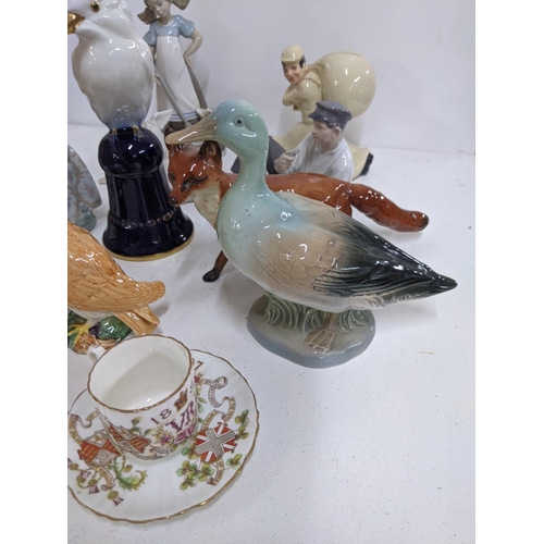 262 - A mixed lot of ceramics to include three Lladro figures, two Beswick models, a Royal Copenhagen figu... 