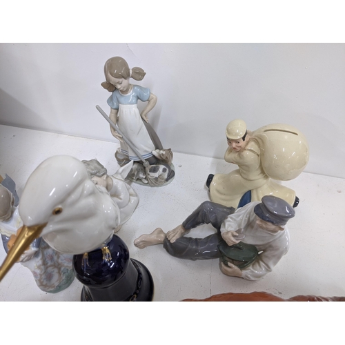 262 - A mixed lot of ceramics to include three Lladro figures, two Beswick models, a Royal Copenhagen figu... 