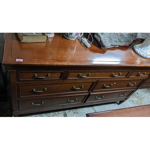 487 - A pair of Wills & Gambier mahogany sideboards, three short drawers over four longer drawers, on squa... 