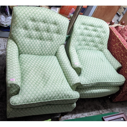 570 - Two similar 19th century armchairs, upholstered in green and white fabric, on turned mahogany legs
L... 