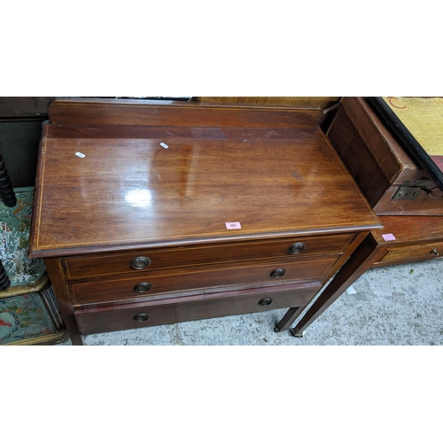 581 - An Edwardian mahogany three drawer chest, 81cm h x 91cm w, and a later mahogany two drawer table, 75... 