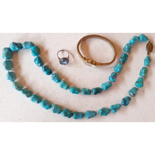 37 - A quantity of costume jewellery to include a string of turquoise stones with silver clasp, simulated... 