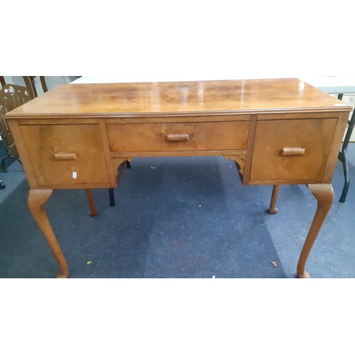 246 - A walnut side/dressing table having three drawers and four cabriole legs, 77cm h x 112cm w x 51cm d
... 