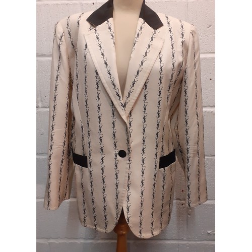 3 - YSL-An early 1980's 'Variation' line cream silk jacket having a monogram design in black throughout,... 