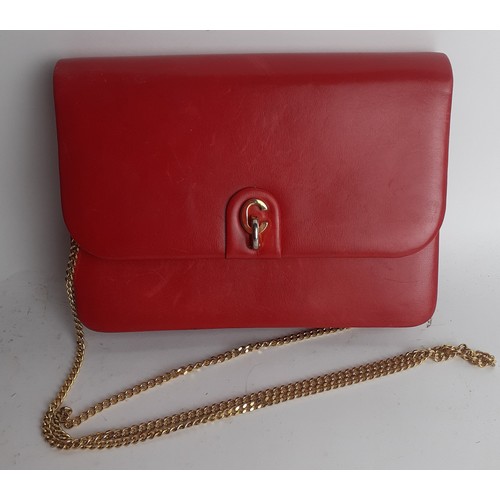 4 - Christian Dior- A 1960's/70's red flap over shoulder bag having a gold tone shoulder chain and gold ... 