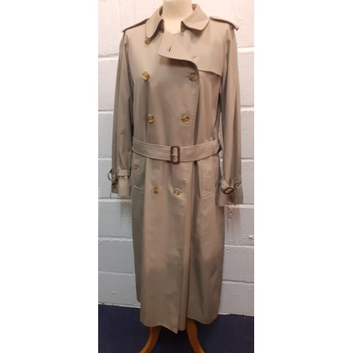 12 - Burberry-A 1970's beige double breasted 'Kensington' lightweight cotton trench coat having brown lea... 