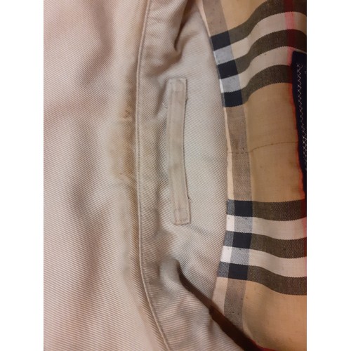 12 - Burberry-A 1970's beige double breasted 'Kensington' lightweight cotton trench coat having brown lea... 