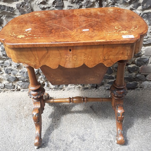 19 - A Victorian burr walnut marquetry inlaid work table having a hinged top and later fitted interior, 7... 