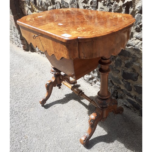 19 - A Victorian burr walnut marquetry inlaid work table having a hinged top and later fitted interior, 7... 