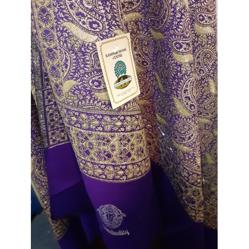 21 - An Emirates Kashmir Shawl Centre superior quality Indian Kashmir shawl in purple with silver coloure... 