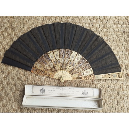 16 - An early 20th Century Chinese inspired fan having 14 composite cut-out wands in an Oriental design w... 