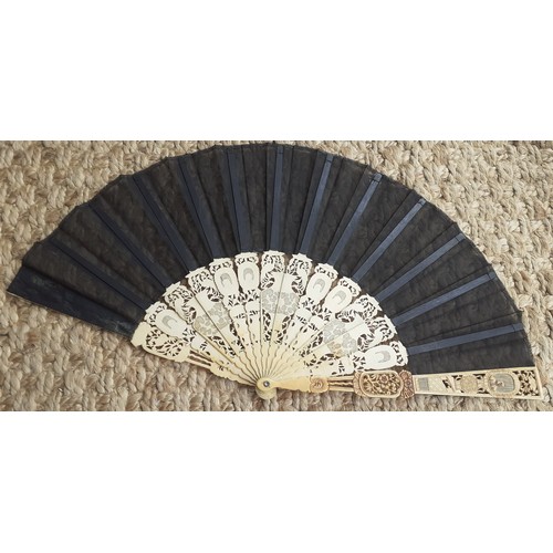 16 - An early 20th Century Chinese inspired fan having 14 composite cut-out wands in an Oriental design w... 