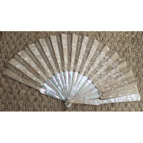 17 - An early 20th Century fan having 14 mother of pearl wands A/F having a cream silk and lace cut-out d... 