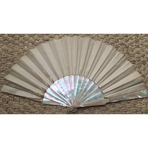 17 - An early 20th Century fan having 14 mother of pearl wands A/F having a cream silk and lace cut-out d... 