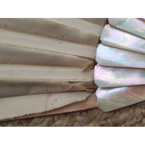 17 - An early 20th Century fan having 14 mother of pearl wands A/F having a cream silk and lace cut-out d... 