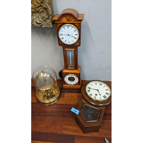 296 - Clocks to include an American example of small proportions, an inlaid cased clock with a barometer a... 