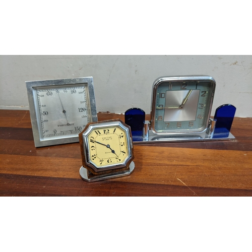 301 - Two Art Deco clocks and another to include a chrome cased barometer, a mantel clock with a later qua... 