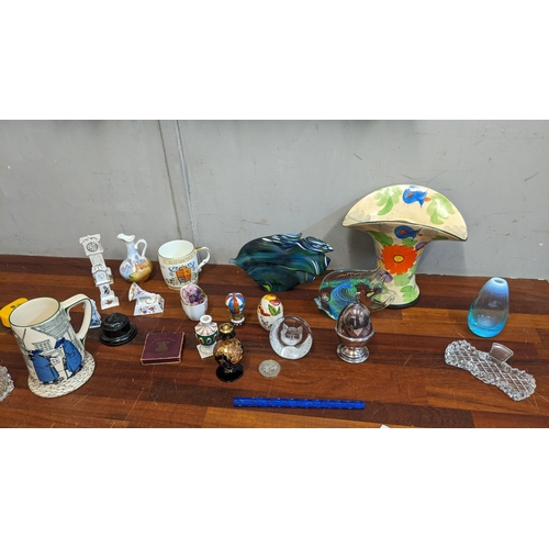 303 - Silver plate collectables, ceramics and glass to include two Murano style glass fish, an Arthur Wood... 