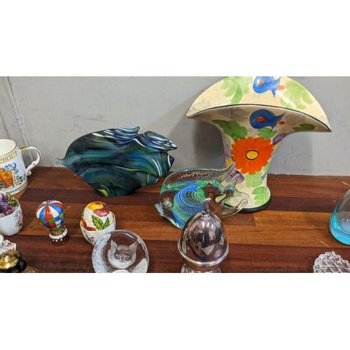 303 - Silver plate collectables, ceramics and glass to include two Murano style glass fish, an Arthur Wood... 