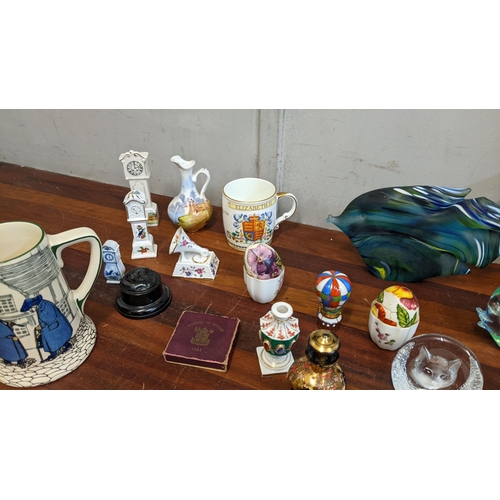 303 - Silver plate collectables, ceramics and glass to include two Murano style glass fish, an Arthur Wood... 