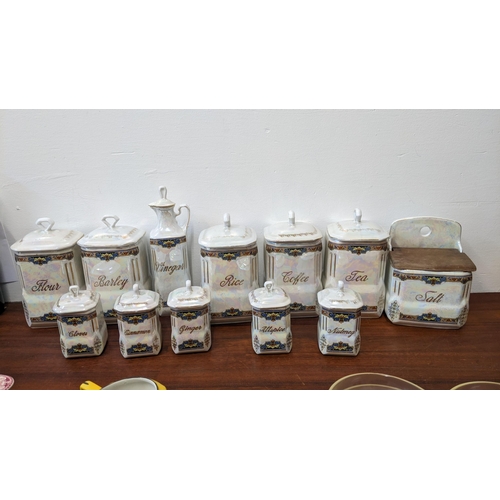 323 - A set of porcelain kitchen storage jars and vinegar jug, 2 A/F
Location:G
If there is no condition r... 