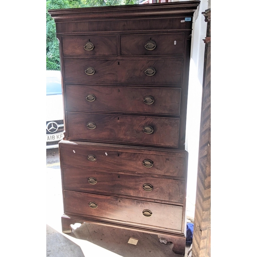 274 - A George III mahogany chest on chest having a moulded cornice, canted corners, two short and six gra... 