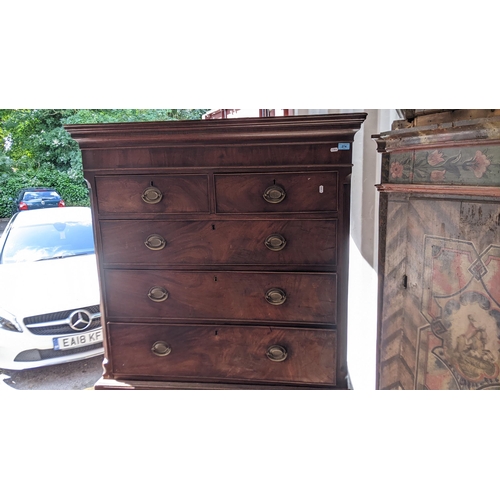 274 - A George III mahogany chest on chest having a moulded cornice, canted corners, two short and six gra... 