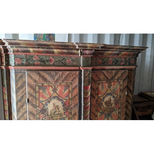 275 - A late 18th/early 19th century Swiss pine painted armoire, having a stepped cornice, painted with pa... 