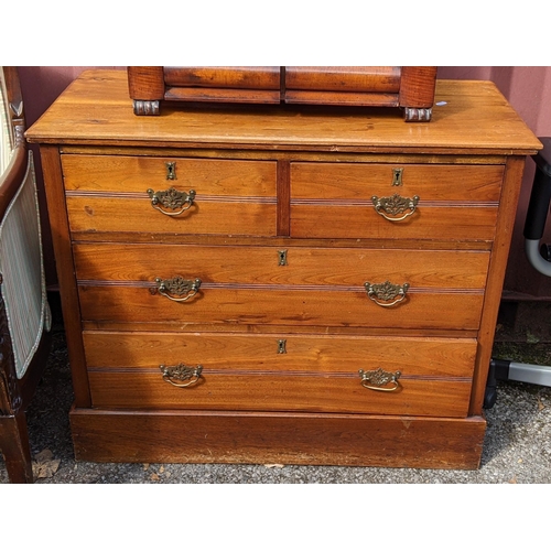 281 - An Edwardian chest of two short and two long drawers standing on a plinth base, 76cm high x 91.5cm w... 