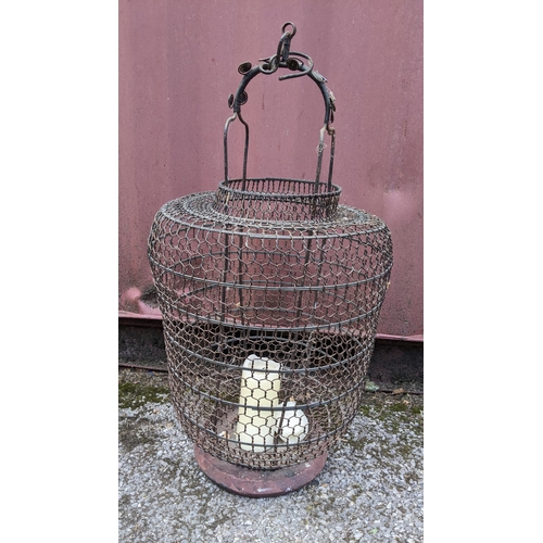 285 - A 19th century Chinese twisted wire work hanging lantern, 77cm high x 38cm wide
Location:RC
If there... 