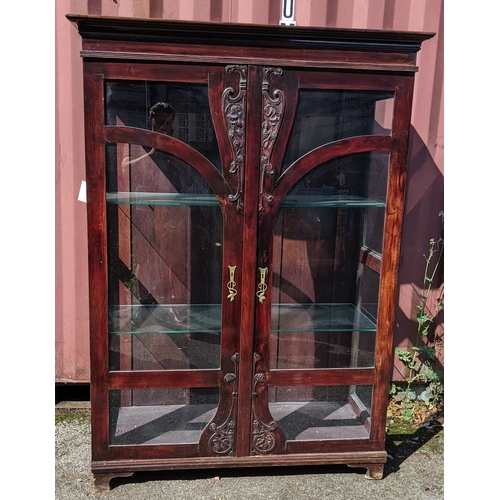 288 - An Art Nouveau mahogany display cabinet having a moulded cornice, two doors with applied floral moul... 