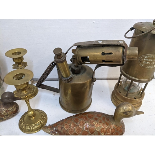 317 - A collection of metalware to include a Ferndale coal miners lamp, a 1926 British Monitor blowtorch, ... 