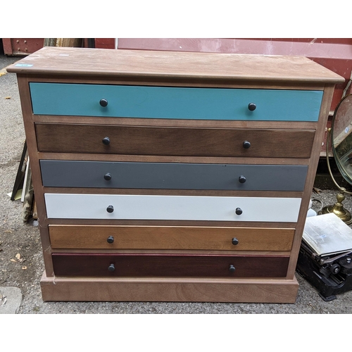 326 - A modern chest of six drawers, each drawer painted a different colour and standing on a plinth base
... 