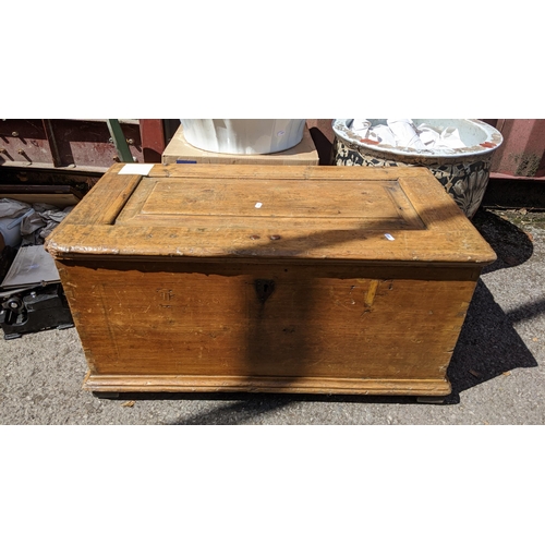 328 - A Victorian pine blanket box having a panelled hinged top and on a plinth base, 44cm high x 88cm wid... 