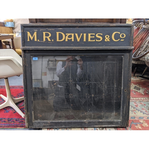 264 - An early 20th century glazed display notice board for M.R Davie & Co, 92cm w x 90cm h x 10.5cm d (ex... 