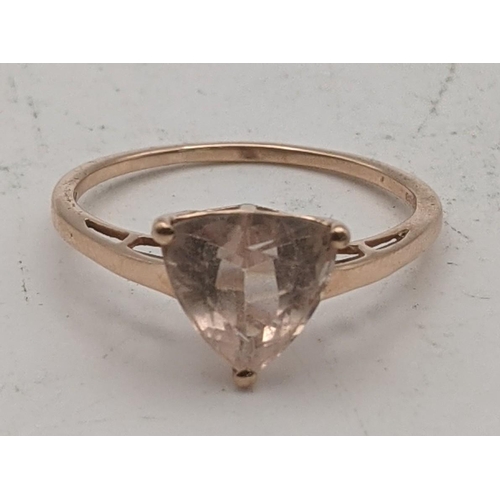 77 - A 10k rose gold ladies ring set with a triangular pink morganite, size S, 1.9g, with a certificate o... 