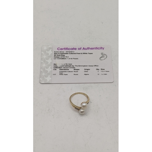 84 - A 9ct gold ring set with two cultured pearls and white topaz, size S, 3.1g, with a certificate of au... 