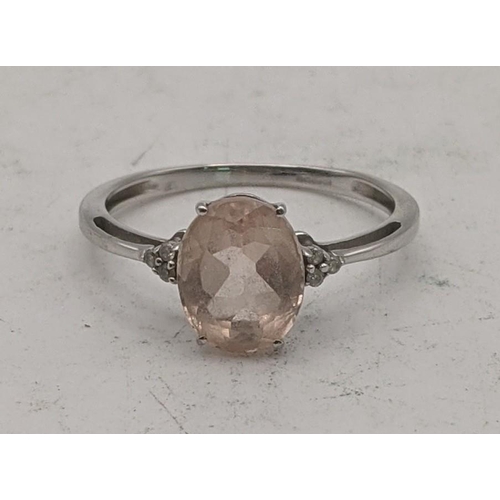 90 - A 9ct white gold ring with a central oval Galieia morganite flanked by diamonds, size S 1/2, 2g, wit... 