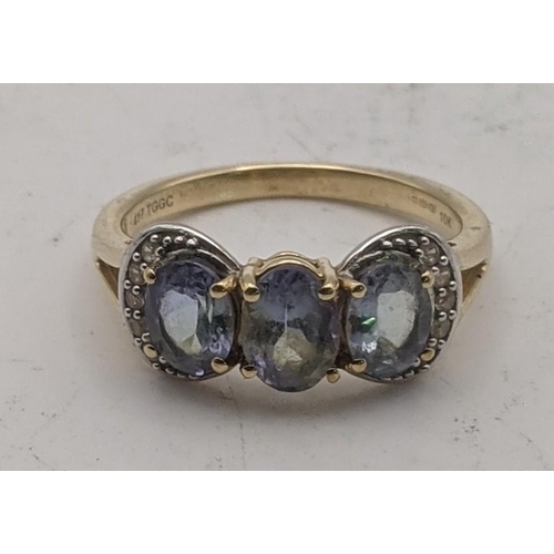 91 - A bi-colour tanzanite and white zircon 9ct gold ring size Q, 3.2g
Location: CAB 7
If there is no con... 