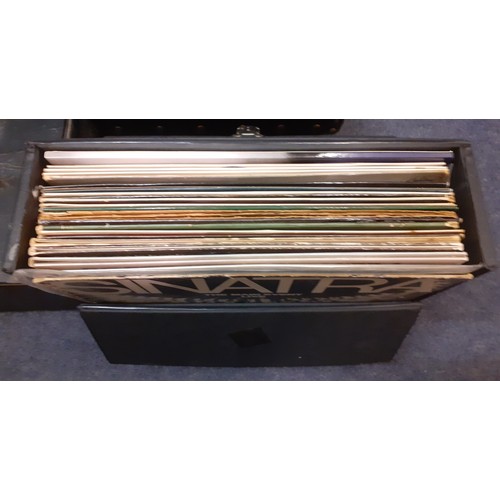 227 - A quantity of mainly 1970's and 80's 45rpm singles all housed in a shallow black case and a record c... 