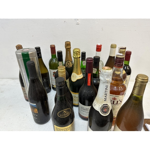 67 - Twenty seven bottles of wine and spirits to include Vodka, Bells Scotch Whisky, Grahams Port, Champa... 