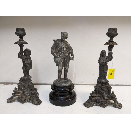 245 - A pair of 19th century French spelter figural candlesticks, and a metal statue of a boy with a hat m... 