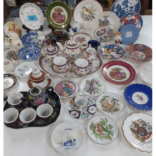 235 - A large quantity of small decorative dishes to include Limoges, Wedgwood, Worcester and Orientals to... 